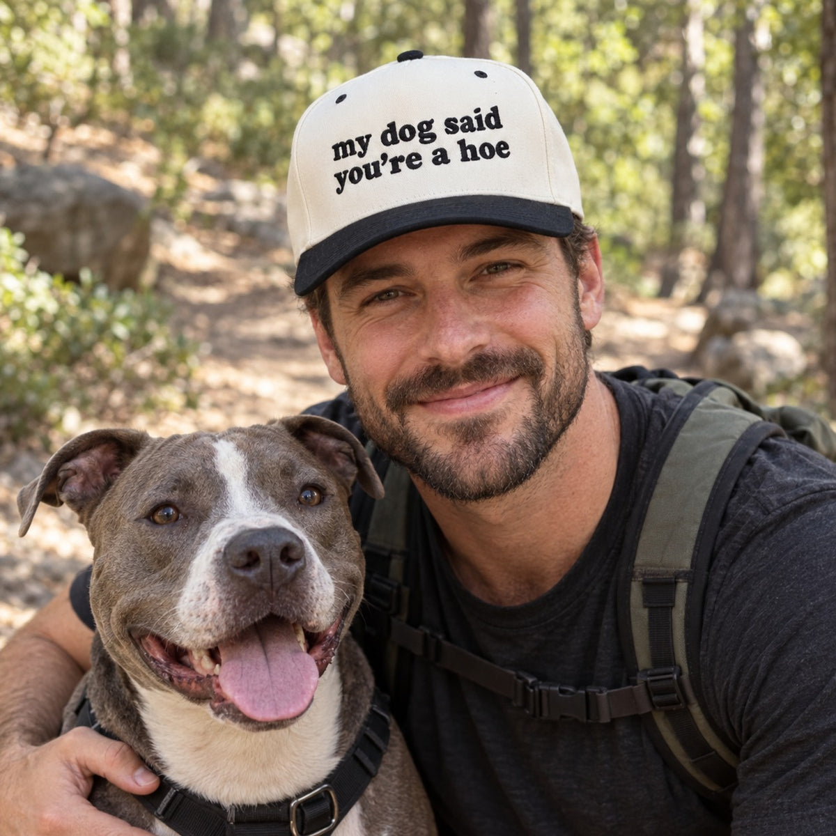Man on a hiking trail with a pit bull wearing the My Dog Said You&