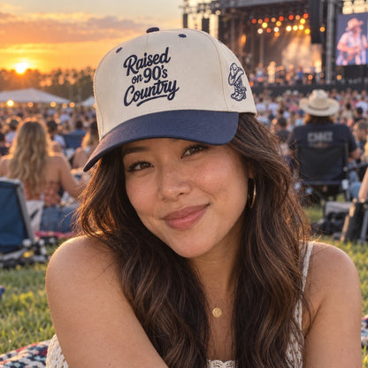 Woman at an outdoor country concert wearing the Raised on 90&