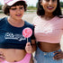 Two women one wearing indigo underboob crop top with 90&