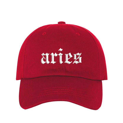 Red Aries Embroidered Baseball Hat featuring crisp white Aries script on a premium cotton crown; a bold astrological statement piece by DSY Lifestyle.