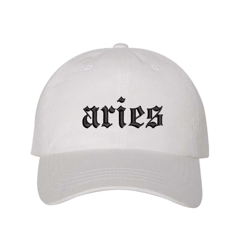 White Aries Embroidered Baseball Hat featuring crisp black Aries script on a premium cotton crown; a bold astrological statement piece by DSY Lifestyle.