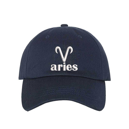 Navy Blue Aries Symbol Embroidered Baseball Hat featuring a sharp white embroidered Ram glyph on a premium cotton crown; a minimalist zodiac statement by DSY Lifestyle.