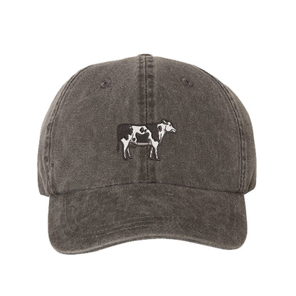 Black Holstein Cow Washed Baseball Hat featuring a detailed black and white Holstein cow embroidered on a premium charcoal washed cotton crown; a heritage-inspired farm life piece by DSY Lifestyle.