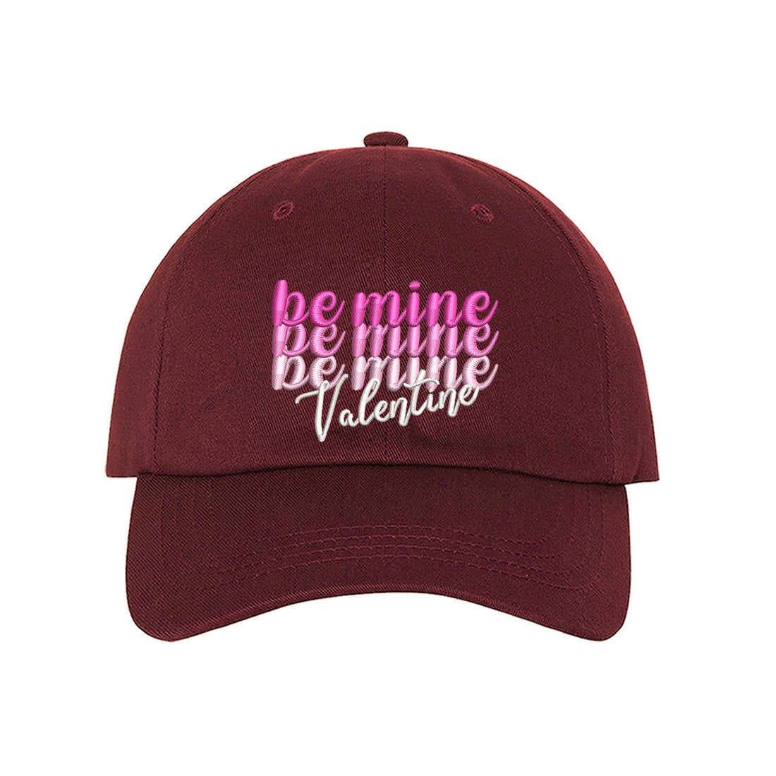 Burgundy Be Mine Valentines Baseball Hat with "Be Mine" stacked embroidered on a classic dad cap, a romantic and giftable accessory from the DSY Lifestyle Valentines Day Collection.