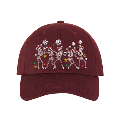Burgundy Dancing Skeletons Christmas Embroidered Baseball Hat featuring festive dancing skeleton embroidery and adjustable hook and loop closure – DSY Lifestyle.