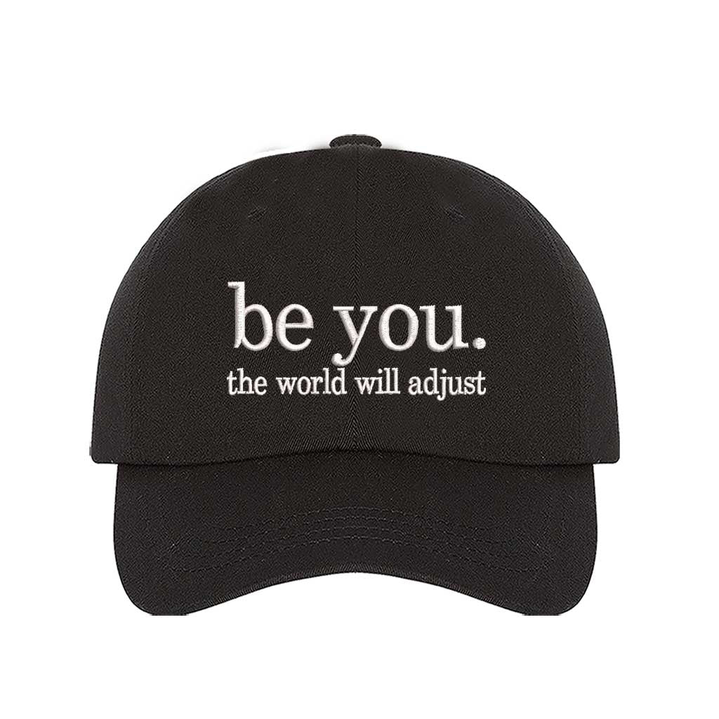 Black Be You The World Will Adjust embroidered baseball hat featuring clean minimalist typography and professional stitching by DSY Lifestyle.