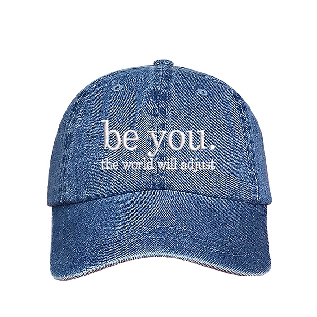 Light Denim Be You The World Will Adjust embroidered baseball hat featuring clean minimalist typography and professional stitching by DSY Lifestyle.