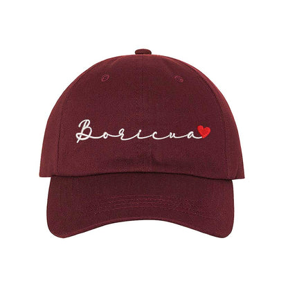 Burgundy  embroidered baseball hat with &quot;Boricua&quot; stitched in cursive and a small heart accent, symbolizing Puerto Rican pride and love - DSY Lifestyle 
