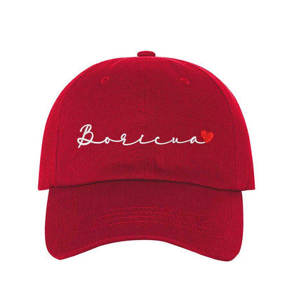 Red embroidered baseball hat with &quot;Boricua&quot; stitched in cursive and a small heart accent, symbolizing Puerto Rican pride and love - DSY Lifestyle 