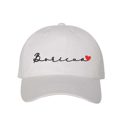 White embroidered baseball hat with &quot;Boricua&quot; stitched in cursive and a small heart accent, symbolizing Puerto Rican pride and love - DSY Lifestyle 