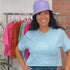 Female wearing a sky blue crop top embroidered with Boy Mama and a lilac bucket hat embroidered with a heart and a paw - DSY Lifestyle