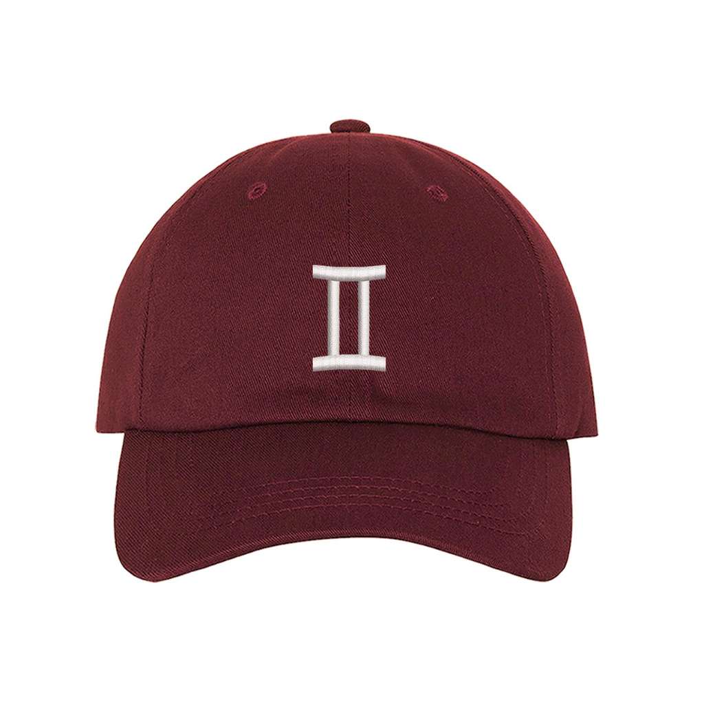 Burgundy baseball hat embroidered with a gemini sign on it- DSY Lifestyle