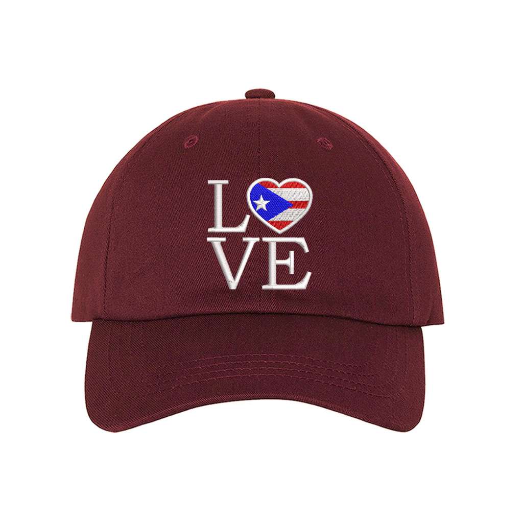 Burgundy baseball hat embroidered with Love but. the o in love is a heart with the puerto rico flag in it- DSY Lifestyle