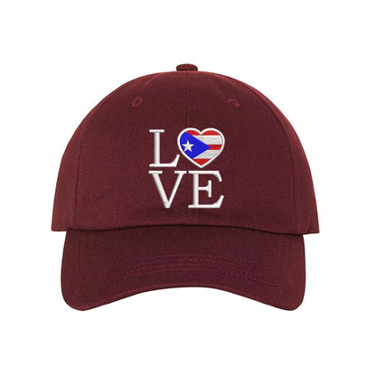 Burgundy baseball hat embroidered with Love but. the o in love is a heart with the puerto rico flag in it- DSY Lifestyle