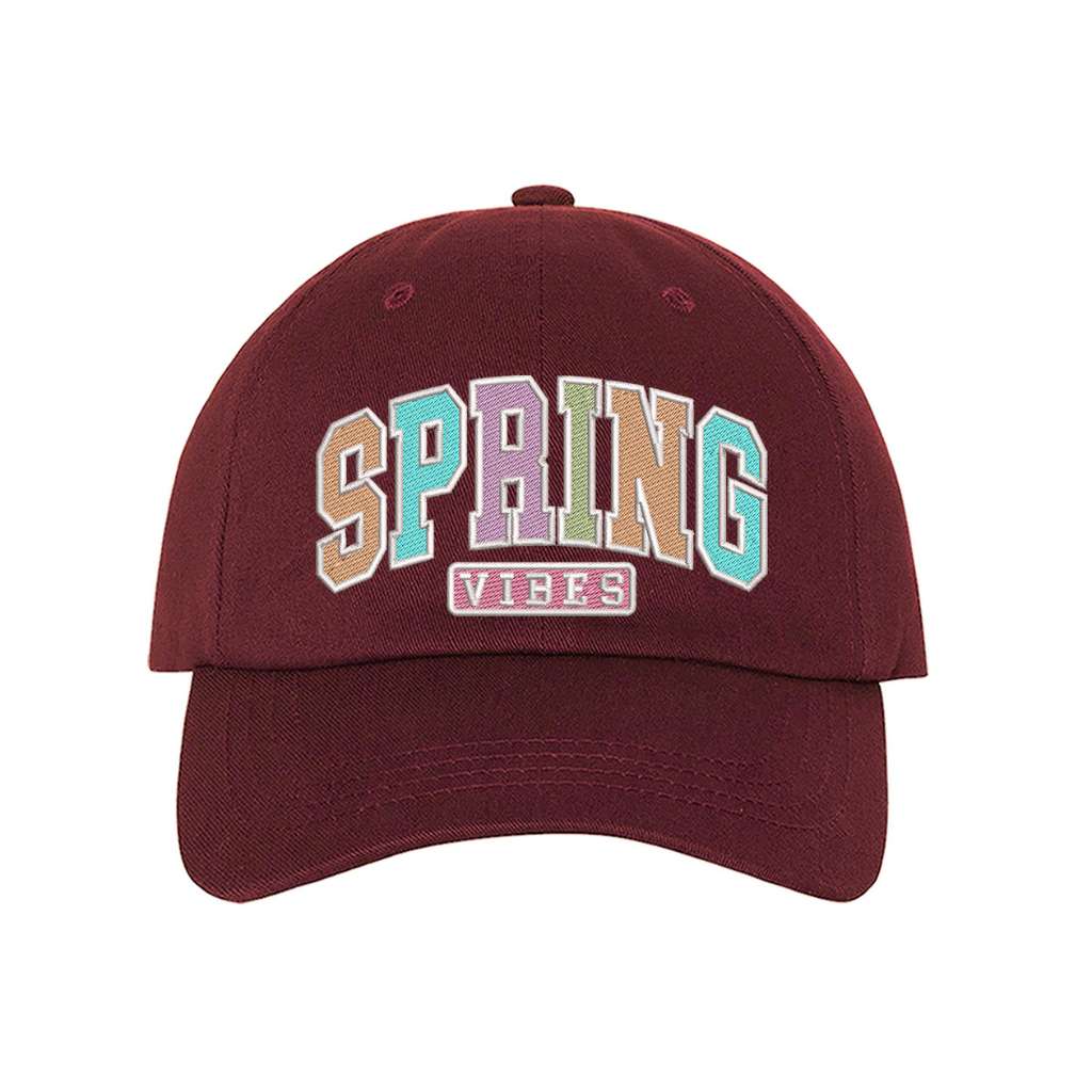 Burgundy baseball hat embroidered with the phrase spring vibes on it- DSY Lifestyle