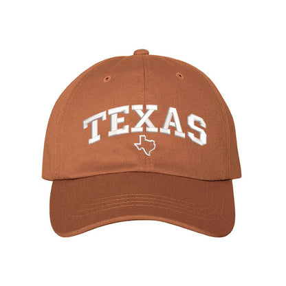 Burnt orange baseball hat embroidered with the word texas and a small map of texas underneath the word- DSY Lifestyle