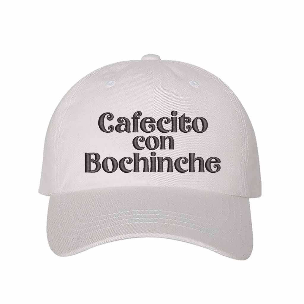 White with black thread Cafecito con Bochinche Embroidered Baseball Hat featuring premium embroidery, adjustable hook and loop closure, and breathable cotton material – DSY Lifestyle