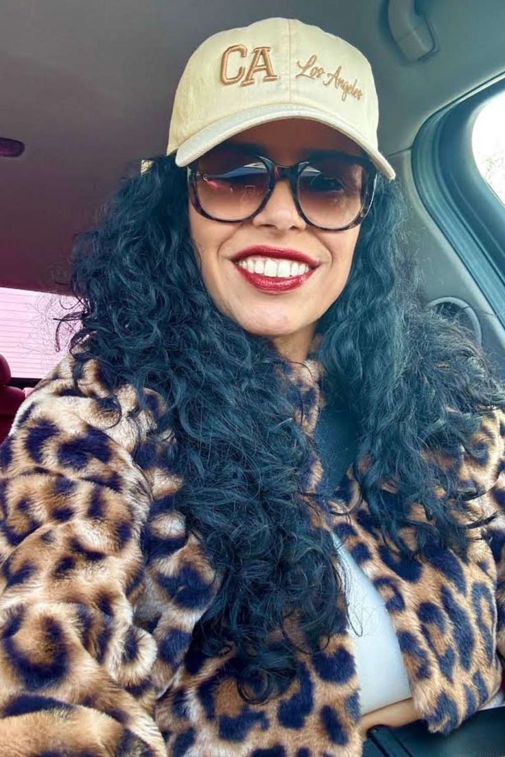 Woman wearing Natural California 3D Los Angeles Embroidered Baseball Hat with raised embroidery, a curved brim, and an adjustable strap for a sleek, comfortable fit paired with leopard print crop top jacket - DSY Lifestyle