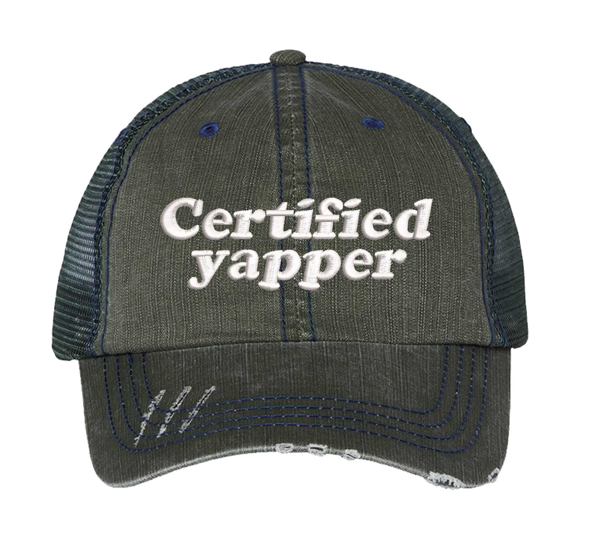 Dark Green DSY Lifestyle distressed trucker hat featuring the phrase Certified Yapper in bold, professional embroidery. - DSY Lifestyle