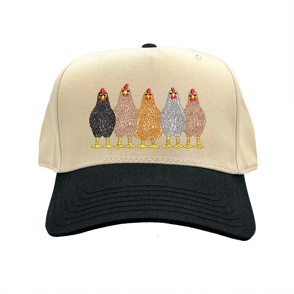 Natural Black DSY Lifestyle two-tone baseball hat with a natural-colored crown and contrasting bill, featuring an embroidered graphic of a mother hen and three small chicks. - DSY Lifestyle