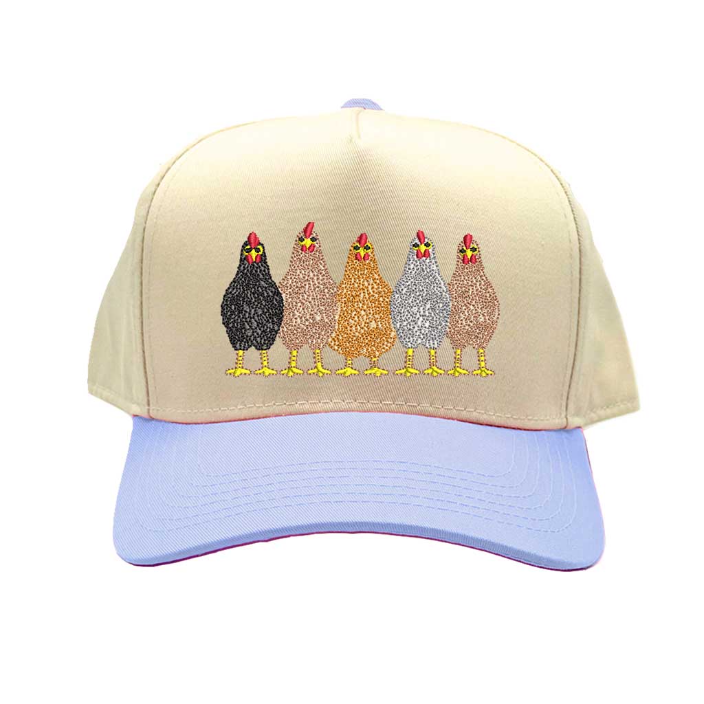 Natural Light Blue DSY Lifestyle two-tone baseball hat with a natural-colored crown and contrasting bill, featuring an embroidered graphic of a mother hen and three small chicks. - DSY Lifestyle