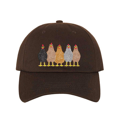 Brown premium DSY Lifestyle cotton baseball hat featuring a detailed embroidered graphic of a mother hen followed by a family of small chicks. - DSY Lifestyle