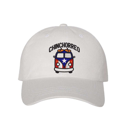 White baseball hat embroidered with the phrase chinchorreo and a van with the puertorican flag on it- DSY Lifestyle