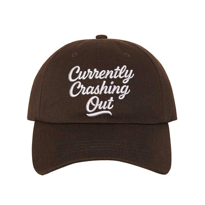 Brown Currently Crashing Out embroidered baseball hat. A statement baseball hat for women who love humor, comfort, and effortless everyday outfits. - DSY Lifestyle