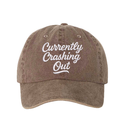 Chocolate Brown Currently Crashing Out Embroidered Baseball Hat – a washed, relaxed-fit statement cap designed for everyday comfort and real-life moods. Trendy, adjustable, and effortlessly stylish. - DSY Lifestyle