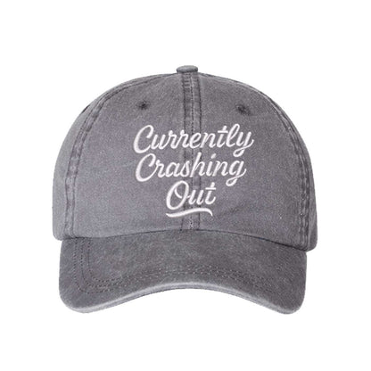 Gray Currently Crashing Out Embroidered Baseball Hat – a washed, relaxed-fit statement cap designed for everyday comfort and real-life moods. Trendy, adjustable, and effortlessly stylish. - DSY Lifestyle