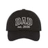 Black Dad Est. 2026 Outline Baseball Hat featuring minimalist outline embroidery on a classic dad cap; a stylish 2026 baby announcement gift for new fathers by DSY Lifestyle.
