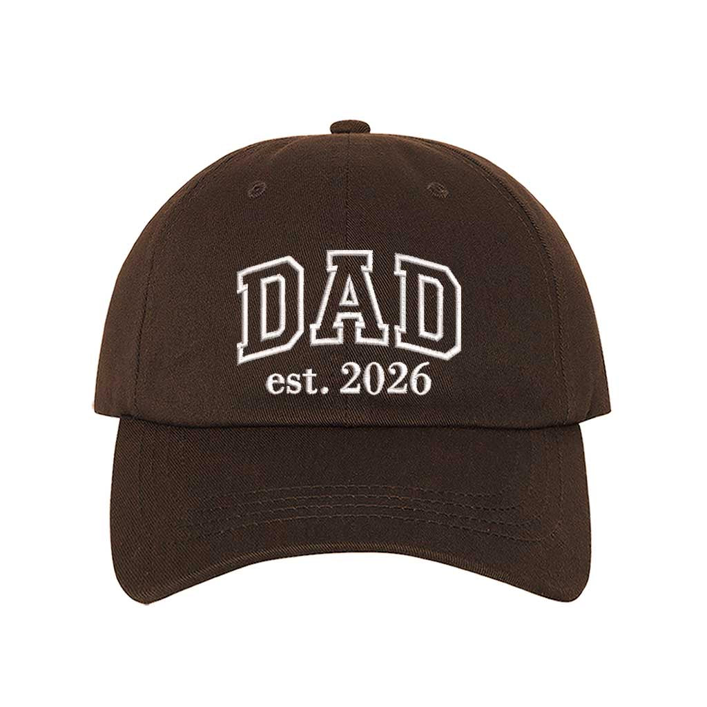 Brown Dad Est. 2026 Outline Baseball Hat featuring minimalist outline embroidery on a classic dad cap; a stylish 2026 baby announcement gift for new fathers by DSY Lifestyle.