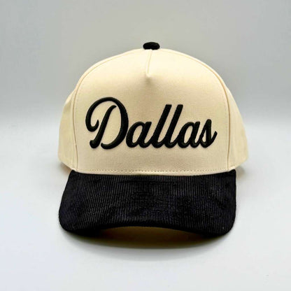 Beige and black cap with &