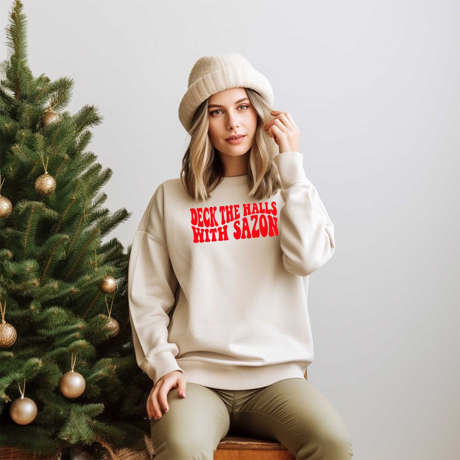 Model wearing Deck the Halls with Sazón sweatshirt, a festive and cozy holiday sweater with Latin flair, perfect for gatherings and holiday celebrations.