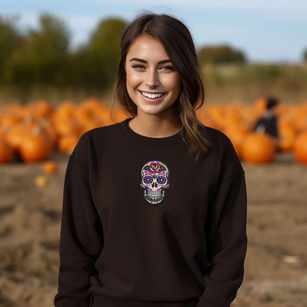 Female wearing brown sweatshirts embroidered with a Dia de los Muertos sugar skull - DSY Lifestyle 