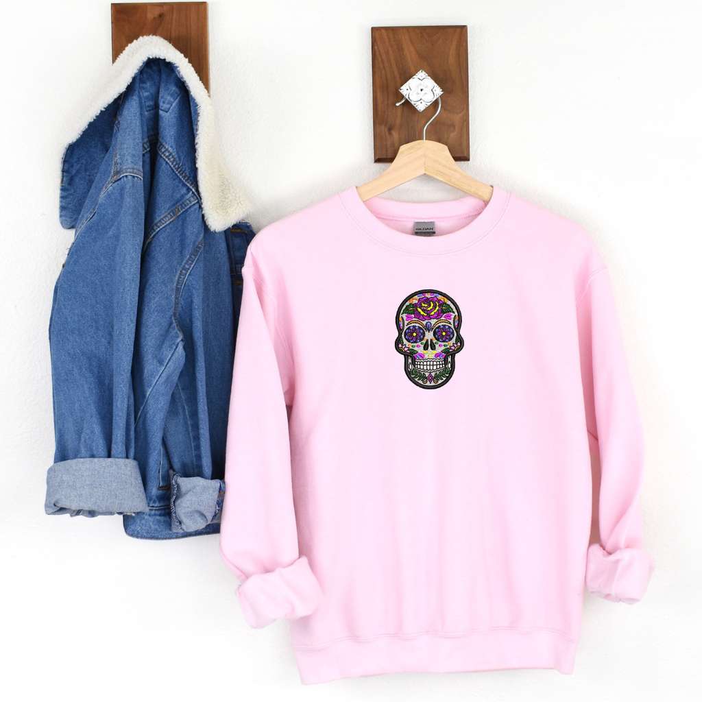 Pink sweatshirts embroidered with a Dia de los Muertos sugar skull - DSY Lifestyle 