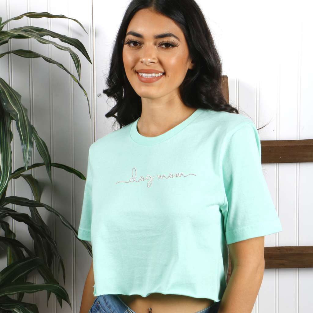 Female wearing a Mint crop top embroidered with Dog Mom - DSY Lifestyle