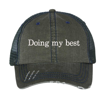 Dark Green Doing My Best Distressed Trucker Hat. This premium vintage-style cap is the perfect gift for the unapologetically bold, featuring a breathable mesh back and custom embroidery. - DSY Lifestyle
