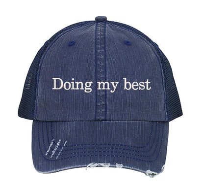 Navy Blue Doing My Best Distressed Trucker Hat. This premium vintage-style cap is the perfect gift for the unapologetically bold, featuring a breathable mesh back and custom embroidery. - DSY Lifestyle