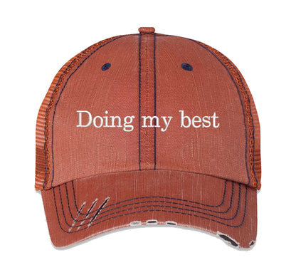 Orange Doing My Best Distressed Trucker Hat. This premium vintage-style cap is the perfect gift for the unapologetically bold, featuring a breathable mesh back and custom embroidery. - DSY Lifestyle