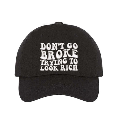 Black Don’t Go Broke Trying to Look Rich Embroidered Baseball Hat in soft cotton with curved brim and hook and loop closure. DSY Lifestyle.
