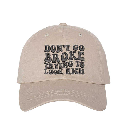 Stone Don’t Go Broke Trying to Look Rich Embroidered Baseball Hat in soft cotton with curved brim and hook and loop closure. DSY Lifestyle.