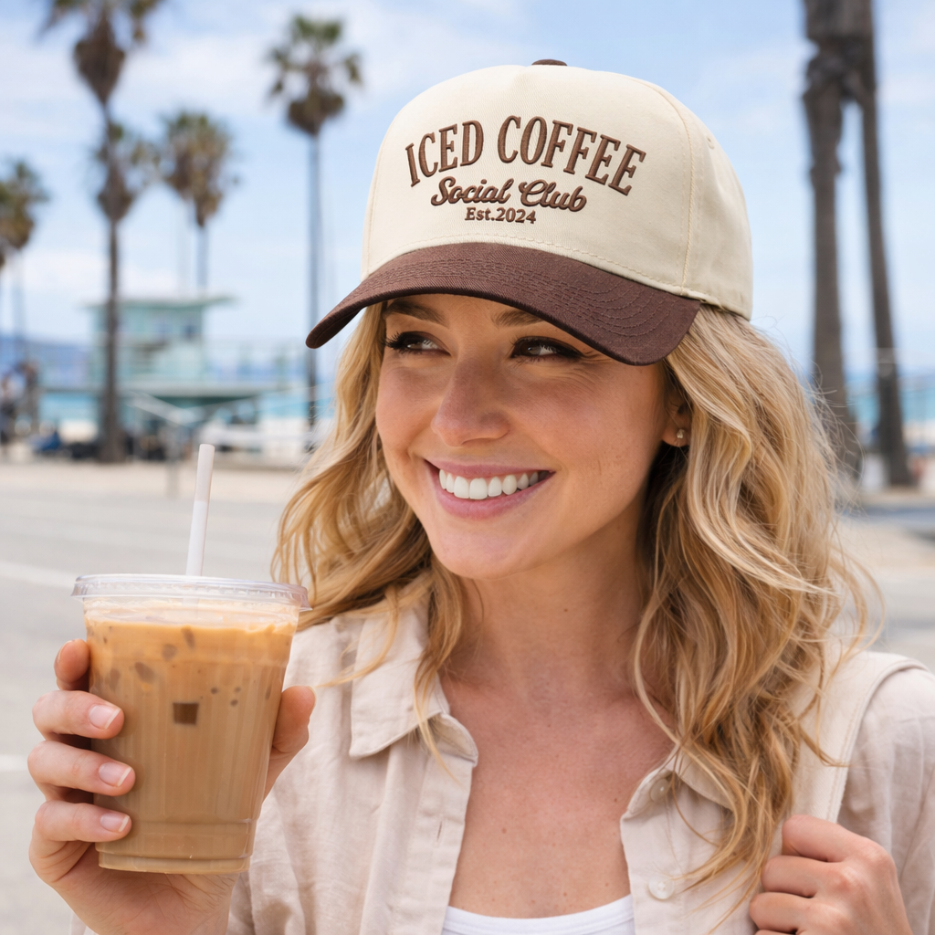 Woman wearing an embroidered ICED COFFEE Social Club&