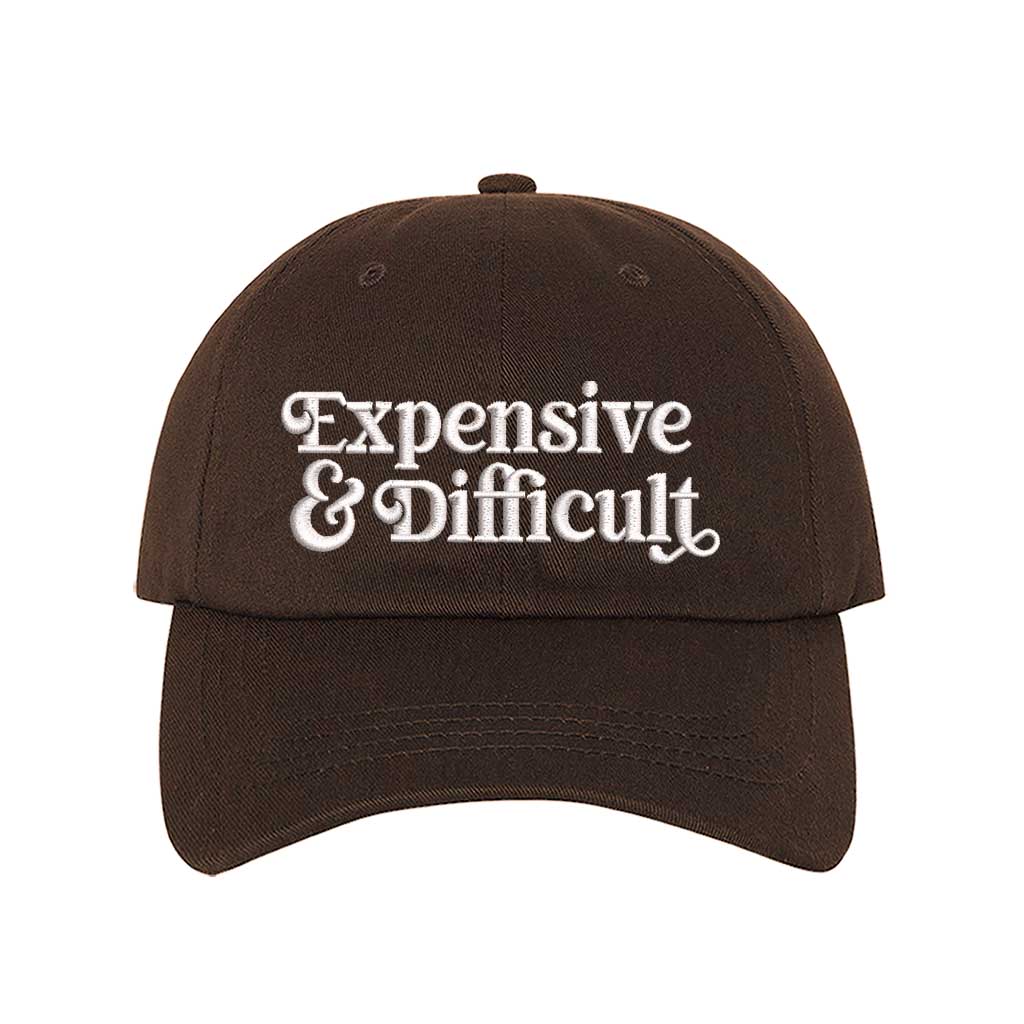 Brown baseball hat embroidered with the phrase  expensive and difficult-DSY Lifestyle