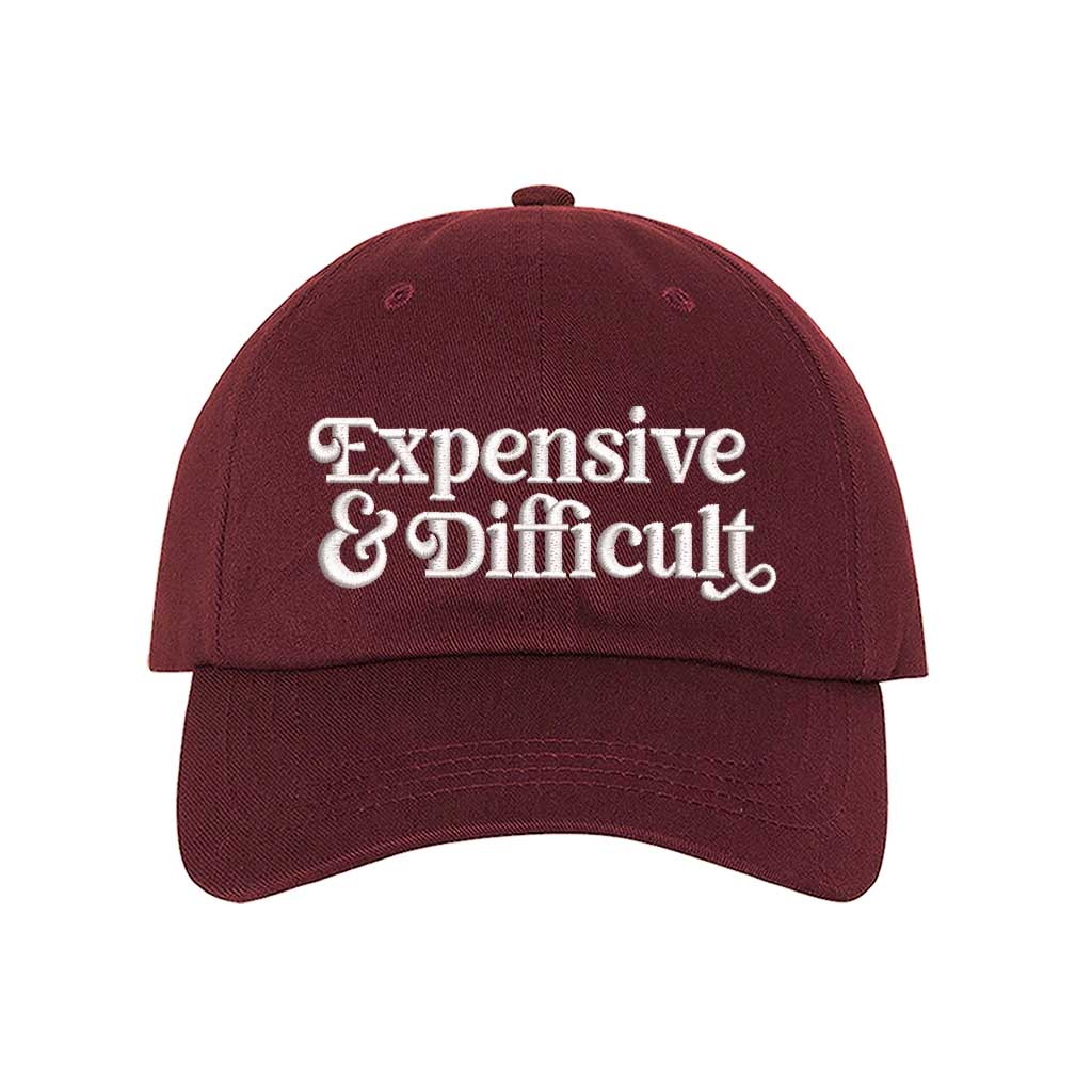 Burgundy baseball hat embroidered with the phrase  expensive and difficult-DSY Lifestyle