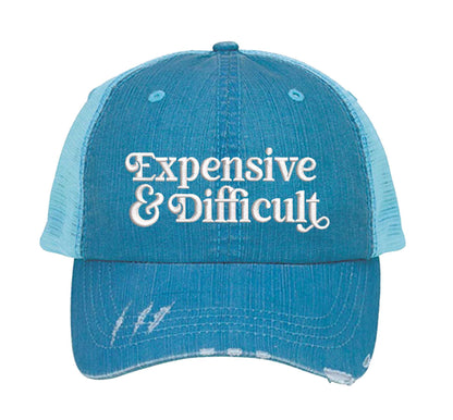 Aqua DSY Lifestyle distressed trucker hat featuring the phrase Expensive &amp; Difficult in bold, professional embroidery. - DSY Lifestyle