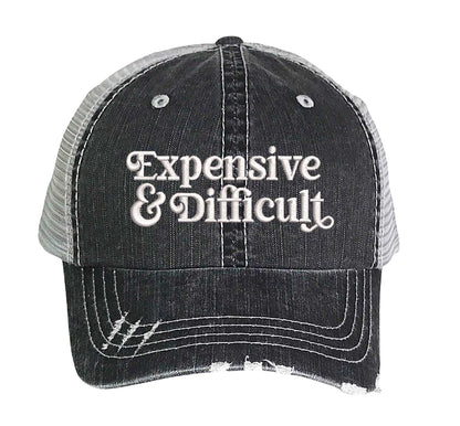 Black DSY Lifestyle distressed trucker hat featuring the phrase Expensive &amp; Difficult in bold, professional embroidery. - DSY Lifestyle