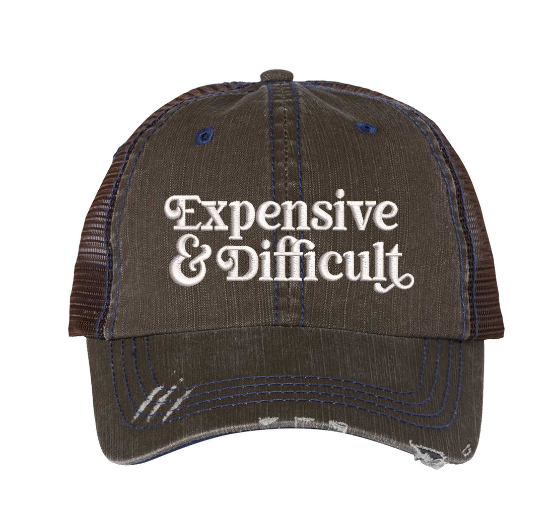 Brown DSY Lifestyle distressed trucker hat featuring the phrase Expensive &amp; Difficult in bold, professional embroidery. - DSY Lifestyle