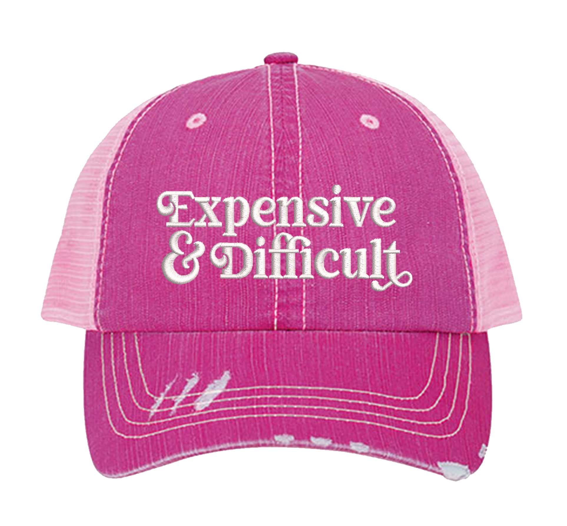 Pink DSY Lifestyle distressed trucker hat featuring the phrase Expensive &amp; Difficult in bold, professional embroidery. - DSY Lifestyle