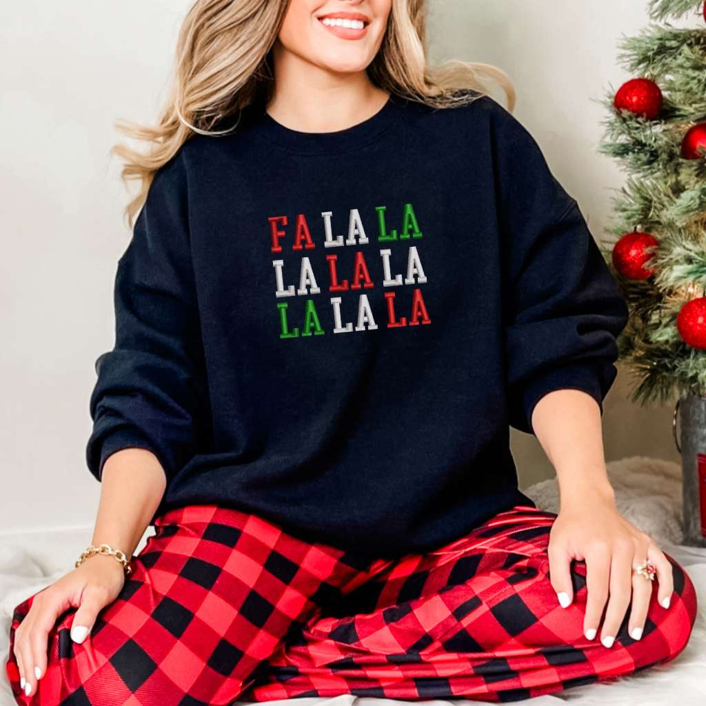 Female wearing a navy sweatshirt embroidered with Fa la la in Christmas Colors - DSY Lifestyle